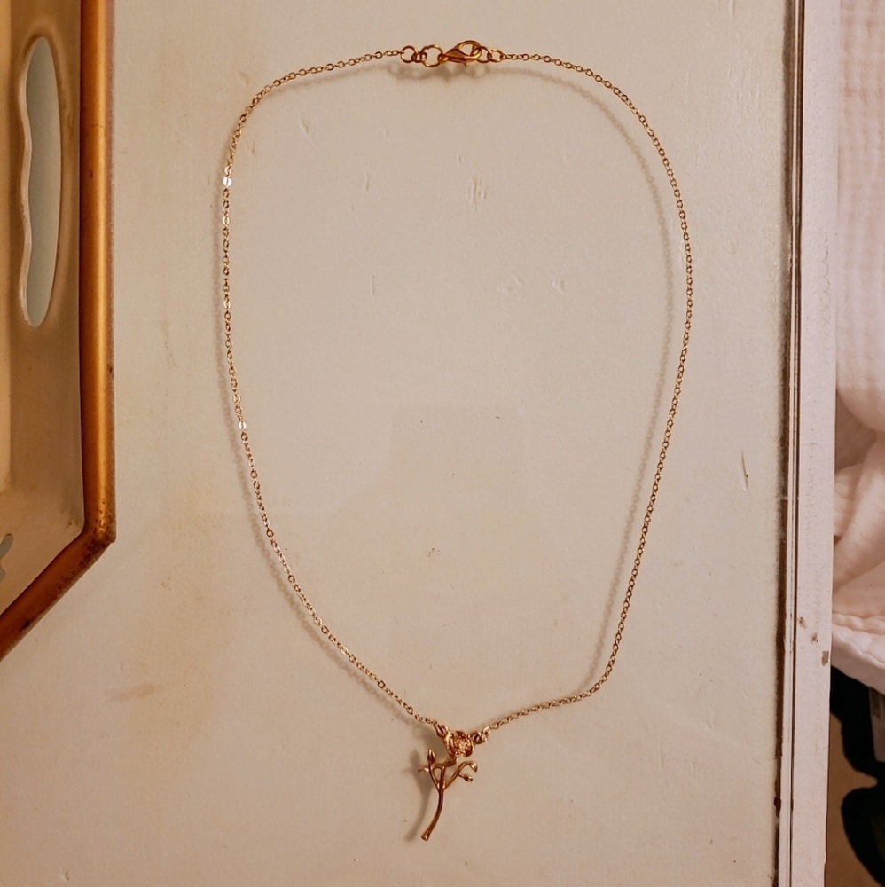 FREE W ANY CLOTHING PURCHASE Gold rose necklace